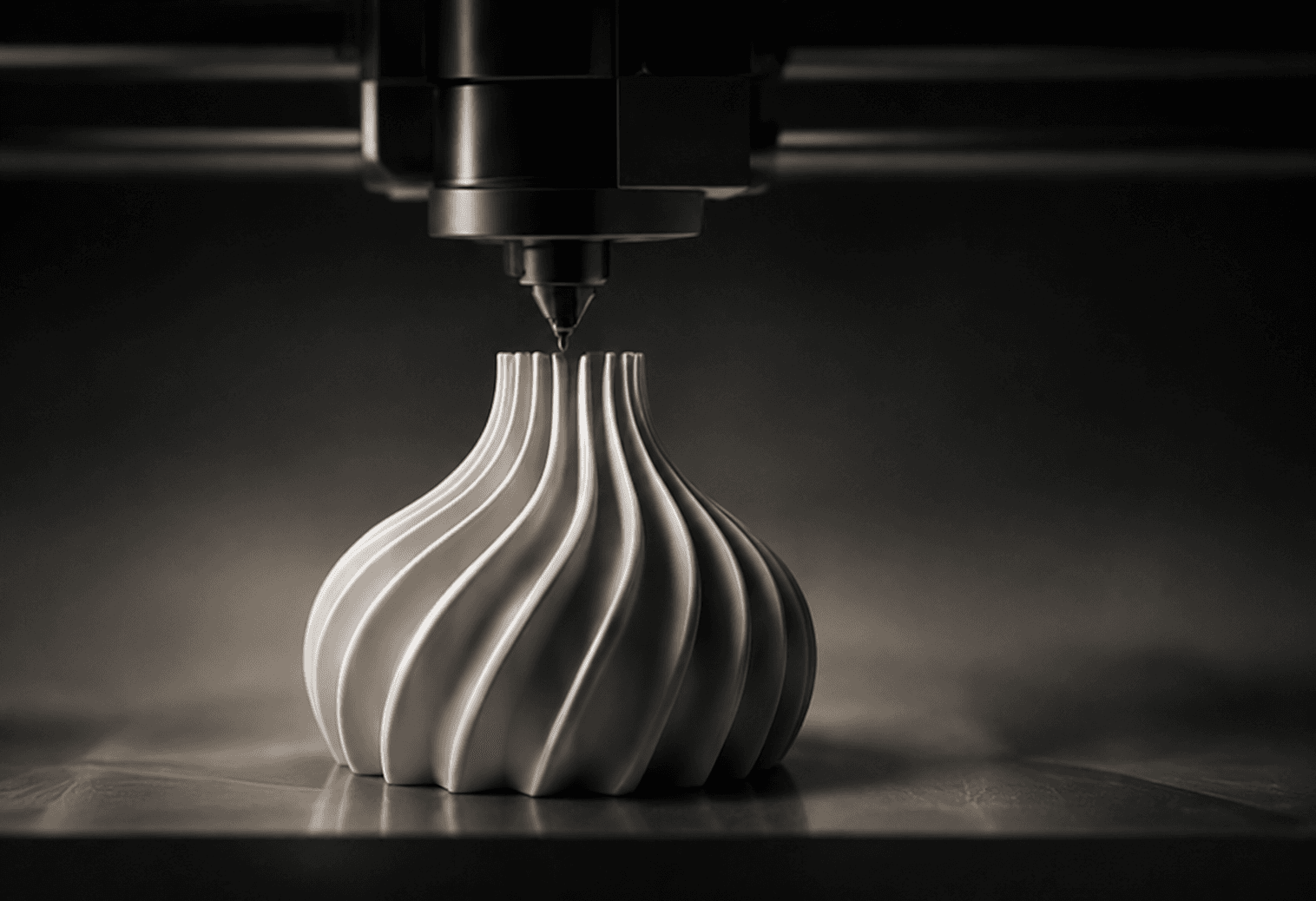 A 3D printer nozzle mid-print on a spiral vase
